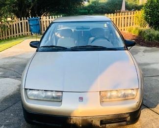 1994 Saturn with 200k miles. Drives well, A/C and Heater work great, and clean interior!