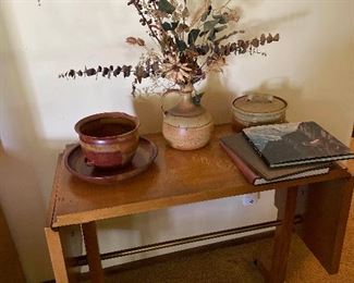 Side Table with Drop Down Sides Pottery and Books