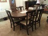 Antique heavy oak table with dark stain and 6 chairs with 2 leaves, resurrected from an Old Washington Historical Park building from the mid 1800's.