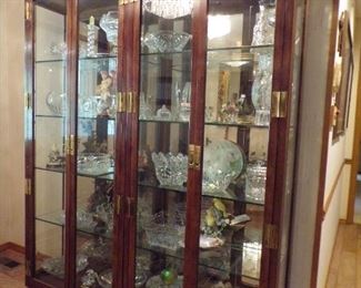 lots of Waterford crystal in this sale, & several curio cabinets