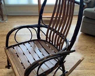 This is a Raymond J Byler hand made rocking chair signed and dated
