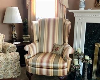 Lovely traditional furniture throughout the house including this pair of Thomasville Wing Chairs 