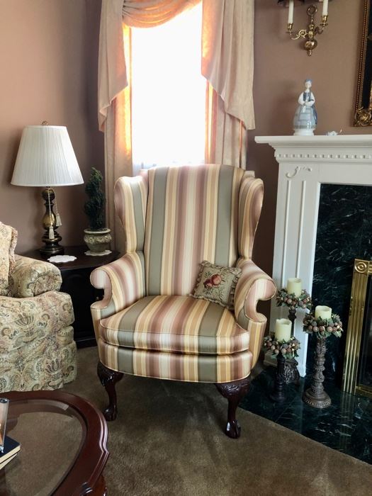 Lovely traditional furniture throughout the house including this pair of Thomasville Wing Chairs 