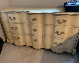 228 French Provincial Serpentine Triple Dresser