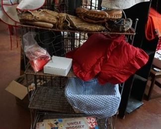old game boards, pillows, ball gloves, aprons