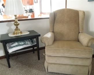 one of two matching beige recliners