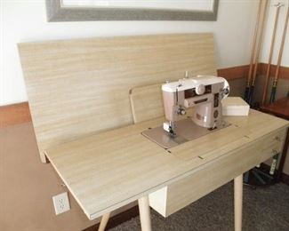 singer sewing machine and  cabinet