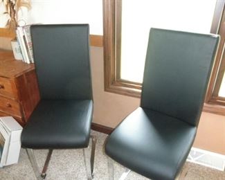 two of four matching chairs