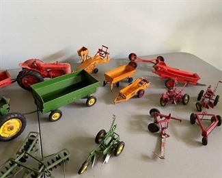 LOT #125 - $350 - Lot of Vintage Tractors & Farm Machinery Toys (John Deere and more, all shown here is included, condition is not perfect, there is some rust, etc.)