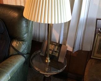 Brass floor lamp with glass tray/shelf.