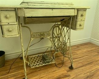 Old Singer sewing machine table with newer working machine inside 