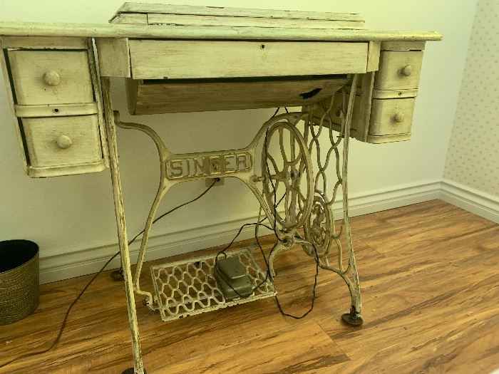 Old Singer sewing machine table with newer working machine inside 
