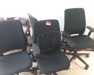 4 black office chairs