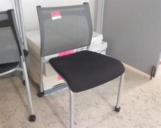 3 Black and grey wheeled office chairs