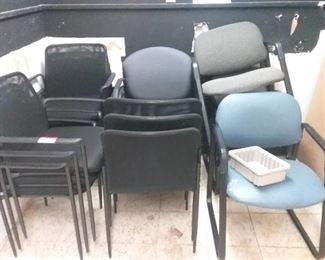 16 office chairs that consist of black, grey, and blue chairs