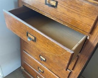 10 drawer tall wooden cabinet