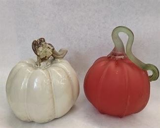 Two pumpkins in glass and pottery.  