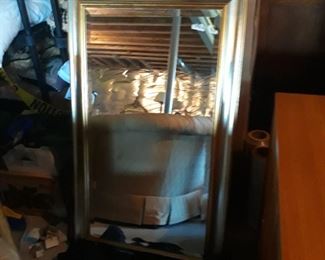 Good size rectangular mittor with accents of gold and silver