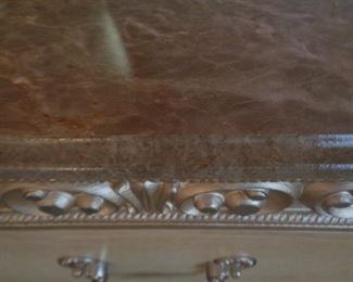 detail of top of night stand and six drawer dresser