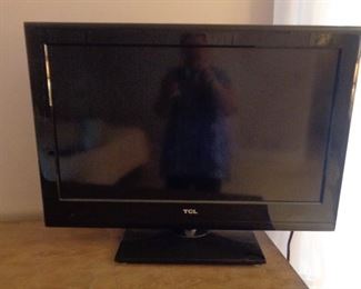 TCL flat screen TV with remote control