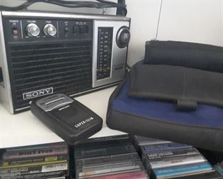 Sony Portable AM/FM Radio, Super Slim AM/FM Radio, CD Canvas Storage Case. Tape Cassettes below.