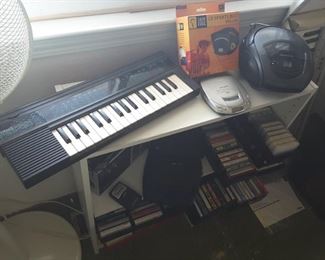 Yamaha Keyboard Portable, Car Ready Discman (Grey Unit), CD Sports Belt Deluxe (Orange Box).