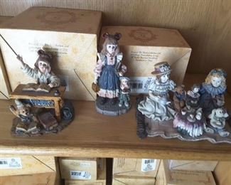 Individual Yesterday's Child Figures on Display with original boxes. These are part of The Boyds Collection, The Dollstone Collection.