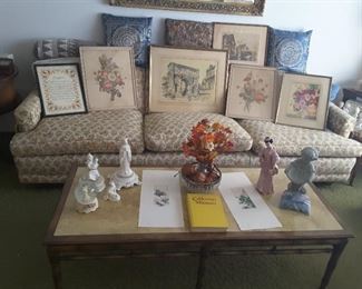 5.5 Foot Long Vintage Wood Coffee Table, Light Yellow Fake Marble Top (not heavy),  Collectibles are Religious on the Right, Snow Globe, 2 Asian Watercolors, California Missions Book, Japanese Figurine, Garden Girl Statue, Glass Round Bowl with Decorative Balls and Fake Fall Flowers in a tiny vase.