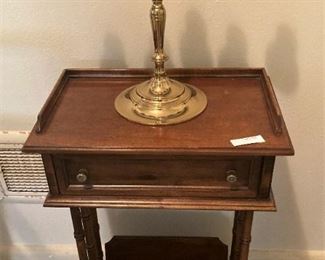 Small side table with drawer and magazine holder; brass candle holder