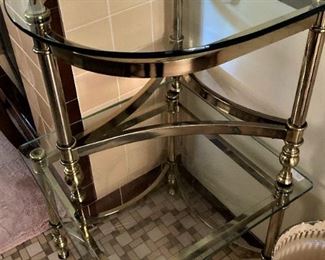 Two (stacked) glass top & brass tables