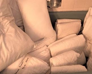 Tub of pillows and mattress covers
