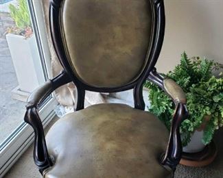 Leather and Wood Chair w/ Arm Rests.  Measures approximately 42" H x 26.5" W x 24" D