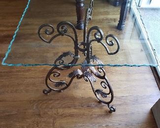 Glass End Table w/ Ornate Metal Base Measures approximately 27" H x 26" W x 26" D
