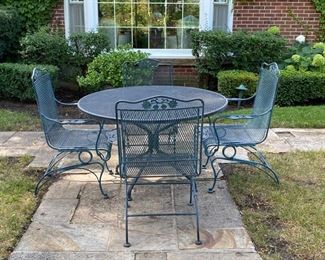  Woodard "Briarwood" wrought iron table & 4 spring coil chairs   table 48" diameter