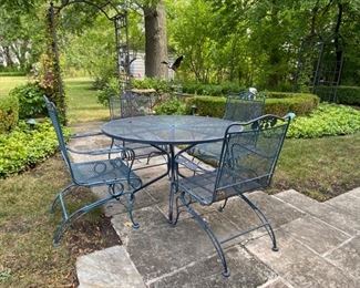  Woodard "Briarwood" wrought iron table & 4 spring coil chairs   table 48" diameter