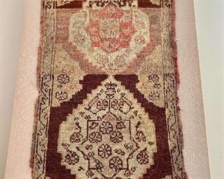$195 -  #2 -Antique rug, mounted on linen - 40"H x 22"W; can be hung vertically or horizontally