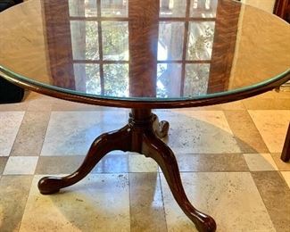 $495 - Flame mahogany pedestal tilt top table with custom glass - 47"D x 30"H