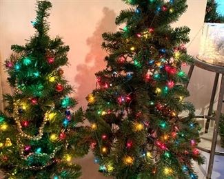 Smaller lighted Christmas trees