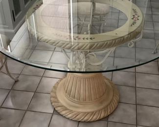 Glass top pedestal table. Wrought iron base. Measures 48" D x 29" H. Photo 3 of 3. 