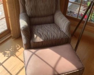Arhaus patterned chair with leather topped ottoman. Measures 27w x 27 d x 37h.  Ottoman measures 25 x 17.  Presale $175…after Sept. 9