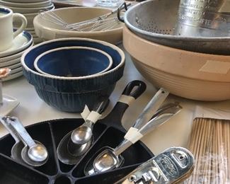 Some antique bowls and a cast iron cornbread pan