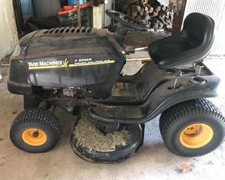 Working riding lawn mower