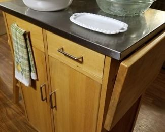 Rolling kitchen island with stainless steel top
