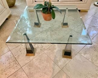 $450 - Beveled glass coffee table with glass obelisk and brass legs - 16"H x 40"W x 40"D 