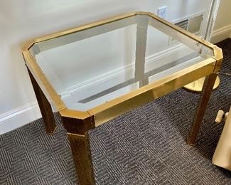 $75 - Brass and glass topped side table. Wear consistent with use. 22"H x 27"W x 22"D