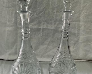$75 EA; Pair cut glass decanters; approx 17” H with stopper