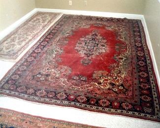 Hand knotted wool oriental runner and a Sarouk area rug, also hand knotted wool.