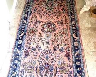 Hand knotted wool oriental runner.