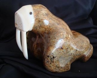 Intuit Eskimo hand carved walrus with ivory or bone face & tusks. Signed by Artist.