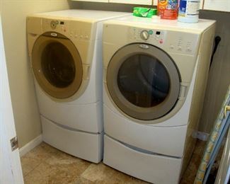 Whirlpool front load washer & dryer with elevating bases.